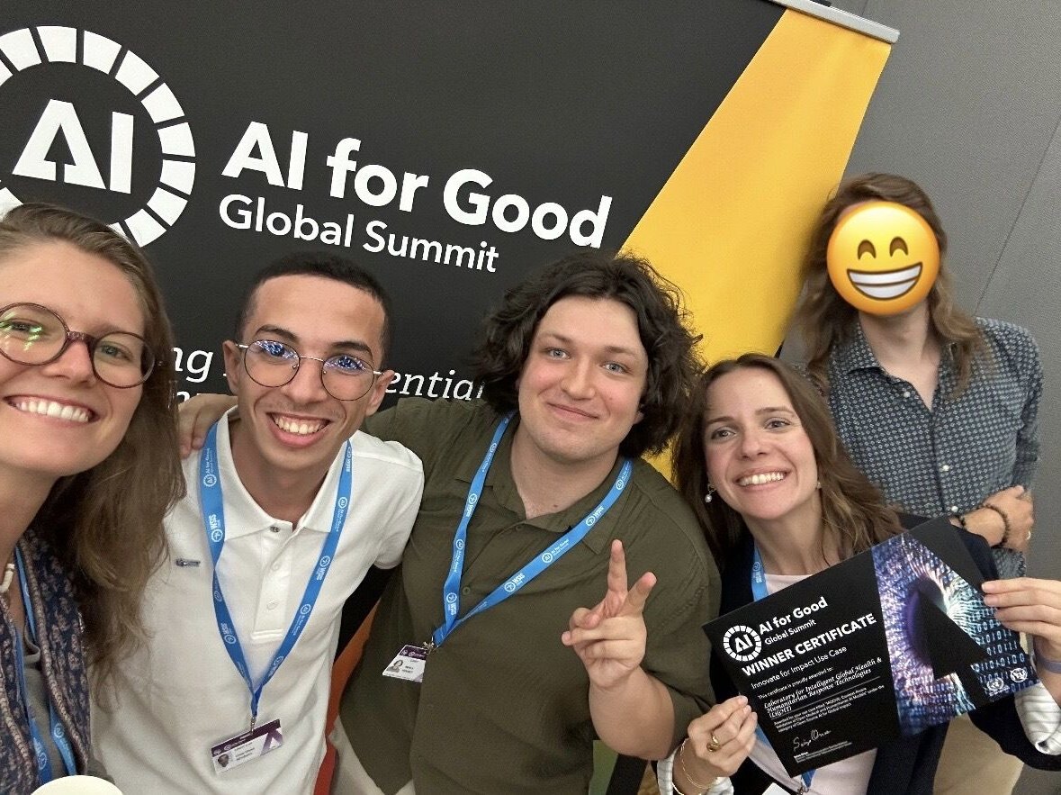 Five people crowd into a selfie under the AI for Good banner, one holding the winner certificate, Omar in a white polo