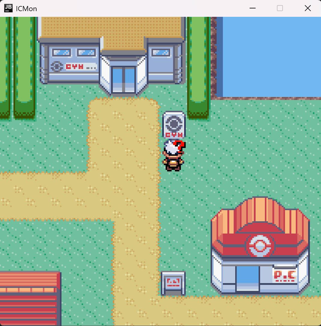 The player under a gym sign in a pixel-art town, with a red-roofed Pokémon Center below and a lake to the right.